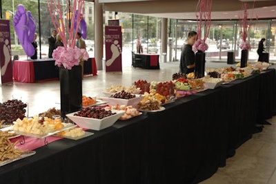 A large buffet table in the main lobby featured a selection of cheeses, fruits, and crudités during the cocktail reception.