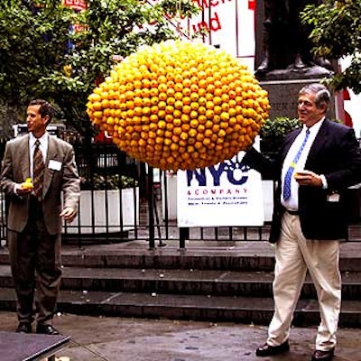Danny Meyer and Tim Zagat clowned around the giant lemon that was lowered to kick off NYC & Company's Restaurant Day.