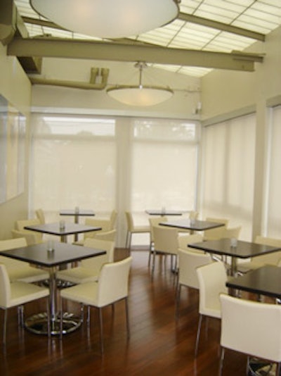 Opaque curtains offer privacy in the dining room.