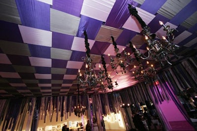 In the lounge area, a dropped ceiling of silk strips and black glass chandeliers formed the main visuals.