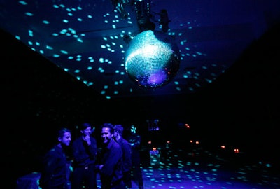The venue's darkest room was the dance floor, where a spotlit disco ball—four feet in diameter—was the only source of light.