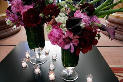 Centerpieces of purple orchids and calla lilies sat on tables in the boutique area.