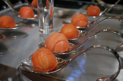 Passed hors d'oeuvres from Design Cuisine included balls of smoked salmon on silver spoons.