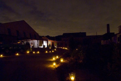 Candles lit a pathway from the dinner venue to the factory building where several acts entertained guests.