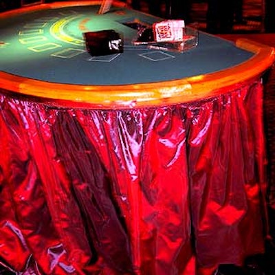 Some casino tables from Minnesota Fats were wrapped with shiny fuschia table skirts by Matthew David.
