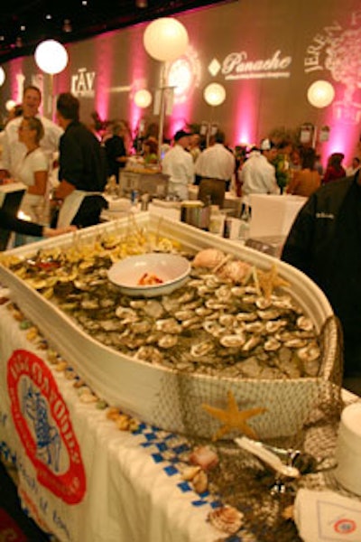 Legal Sea Foods provided a raw bar stocked with oysters and shrimp cocktail displayed in a small rowboat.
