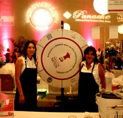 Eventgoers were invited to spin the wheel at the auction table for special prizes.