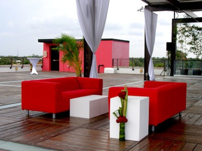 The rooftop's decor, from the tables and chairs to the draping and flowers, was all red and white-just like the Miami Heart Gallery's logo.