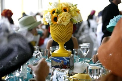 The yellow, blue, and red centerpieces mimicked the hues in a postcard from the 1933 Chicago World's Fair.