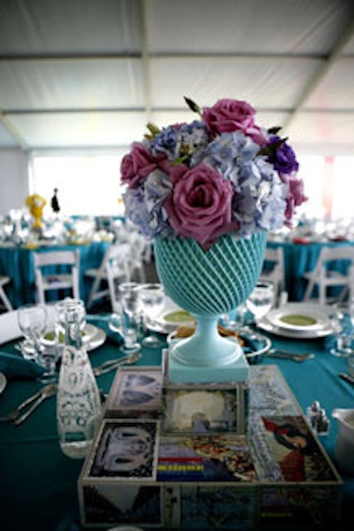 Kehoe Designs' Vince Hart used vintage postcards to decorate the risers beneath centerpieces.