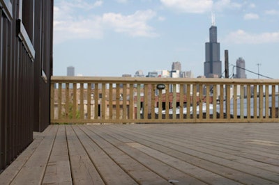 Attached to the upper level, a deck overlooking the city skyline has a 150-person capacity.