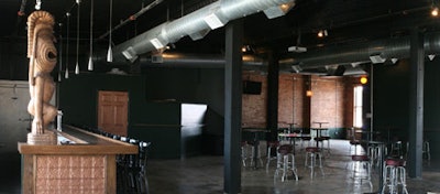 Oversize tiki statues inspired the upper level's 'Volcano Room' title.