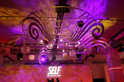 MKG Productions designed and built the chandelier perched above the stage in the center of the room.