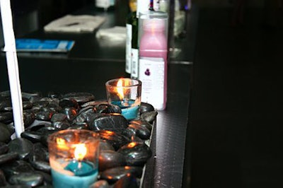 Lit blue candles and stones were part of the event's decor at the Billboard Factory.