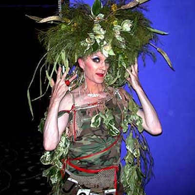 Drag performer Lavinia modeled a Survivor-themed outfit designed by Mark Musters of Musters & Company for the Tulips & Pansies: The Headdress Affair benefit for Village Care of New York.