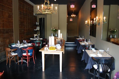 Vintage chairs and chandeliers are decor features of the main dining room.