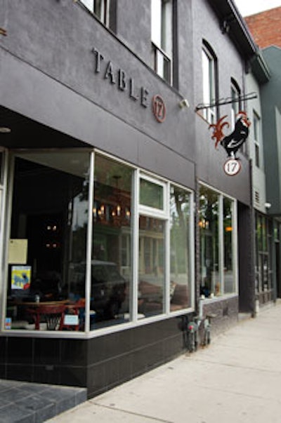 A rooster logo is carried throughout the restaurant, including the front sign.