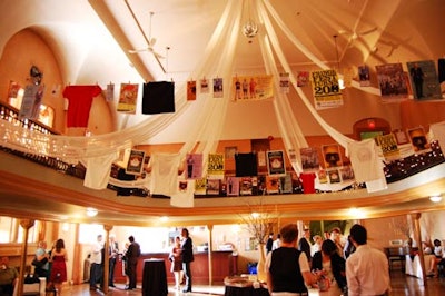 The decor included white drapery and posters hanging on clotheslines, a tradition at Fringe Festival venues.