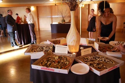 Guests dined on gourmet pizzas, and two large birthday cakes for dessert.