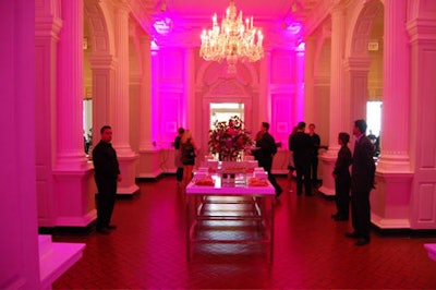 Ivan Carlson designed a pink lighting scheme for the cocktail reception, which featured champagne, specialty martinis, and a buffet table laden with bread, wine, and cheese.