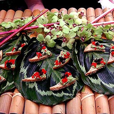 For the Wildlife Conservation Society's benefit at Central Park Zoo, Match Catering and Eventstyles' exotic hors d'oeuvres featured Marrakesh toasts with mashed fava bean laid out on a giant Calathea Medallion leaf on a bamboo platter.