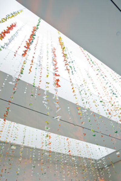 Hand-painted butterflies made of feathers hung over guests in the gold room.