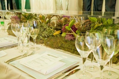 Plants native to the High Line, such as moss, ferns, and herbs, surrounded sections of train rails in centerpieces.