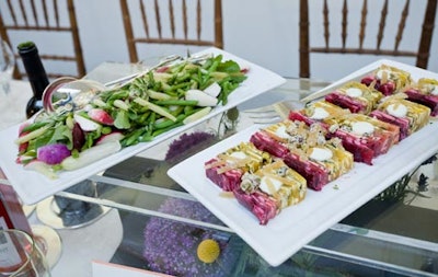 The dinner's first course included ruby and gold beet parfait with goat cheese and a salad of shoots and micro herbs.