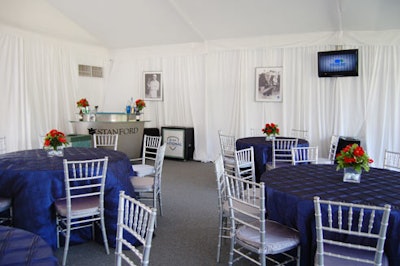 Stanford kepts its chalet simple with royal blue linens, silver Chivari-style chairs (identical to those in the Chevron chalet), and golf photographs on the walls.