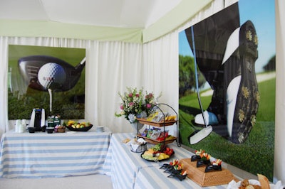 Large glossy golf shots decorated the food display of assorted vegetables, fruits, and potato chips at the UBS chalet.