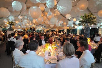 White and pale-blue paper lanterns hung from the top of the dinner tent, where guests sampled the garden-themed menu.