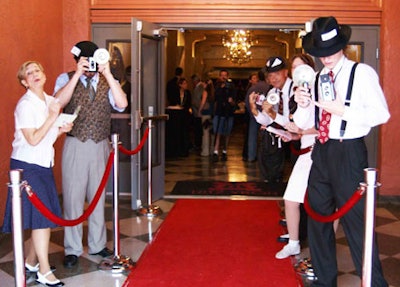 Partygoers were treated as celebrities as they arrived and departed, passing through a myriad of entertainers acting as paparazzi.