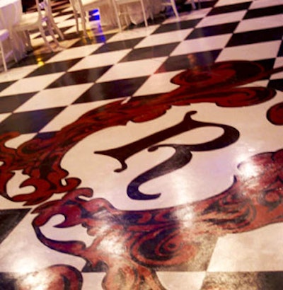 Branding the event was key in creating a cohesive theme. A large logo on the checkerboard dance floor acted as a fantastic focal point.