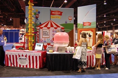 Microsoft's circus-style booth at the front of the trade show included free cotton candy and a test of strength.