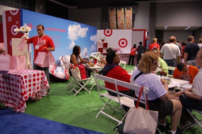 The second half of Target's space offered weary expo-goers a picnic-style seating area and gift bags filled with a disposable camera and a photo box.