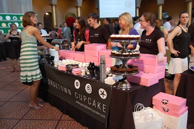 Georgetown Cupcake—one of the participating shops—covered its station with pink boxes and tiered platters topped with cupcakes.