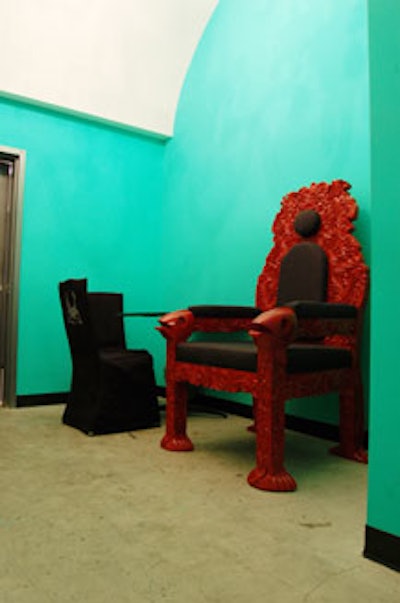 The green room is painted green and is attached to a bathroom and makeup area.