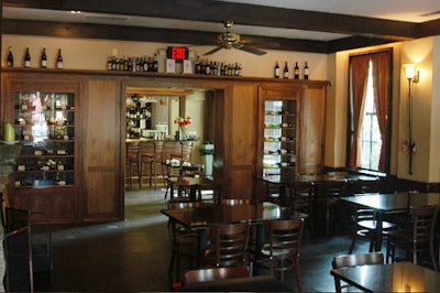 Covered in dark wood, the dining area showcases every wine on offer and seats 64.