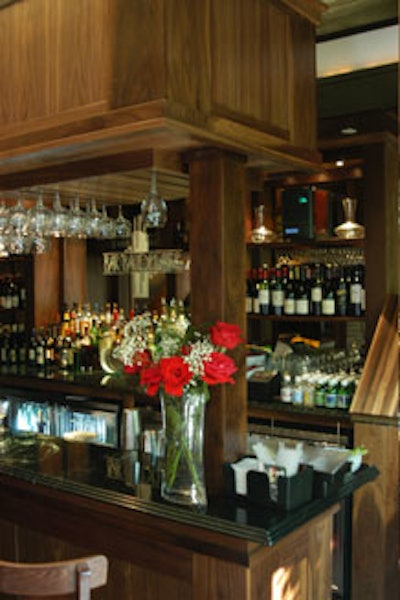 Bar Baudelaire includes a 16-seat black granite bar accented by dark walnut wood.