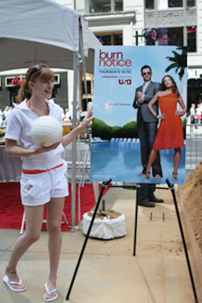 Soza Models carrying volleyballs spoke with passersby.