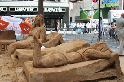 Sand sculptor Mark Mason and his team created the bikini- clad models and a few other beachgoers to keep them company.