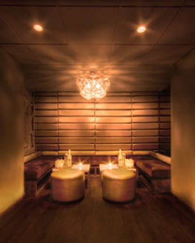 Warm tones of amber and bronze, plush banquette seating, and various types of lighting modernize the 12-year-old Spybar.