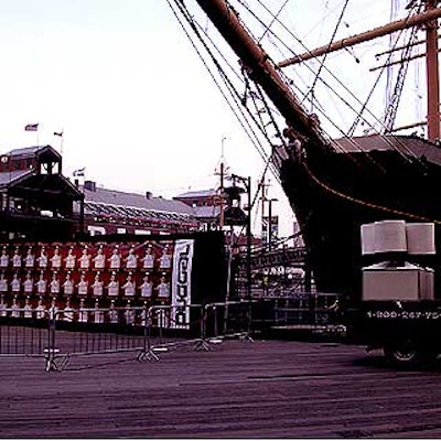 Guests for the private cocktail party aboard the Peking were greeted by searchlights and banners on the boardwalk.