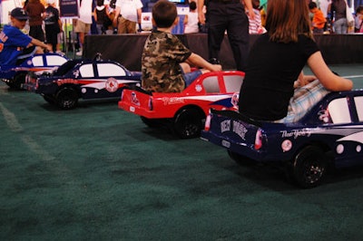 Kids too young for the batting cages raced pedal cars adorned with team logos.