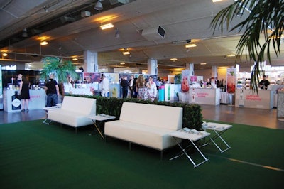 The L.C.B.O. dressed its ImaGINe lounge in white leather furniture and palm trees.