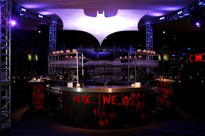 A giant steel bat symbol hovered over the graffiti-decked central bar.