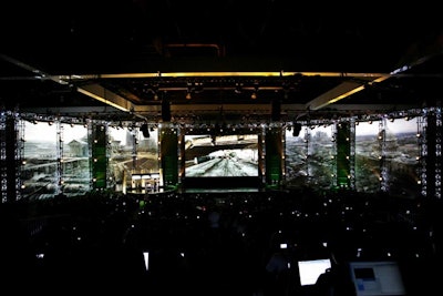 The center screen played live game shots and demos, while the side screens presented still shots from games.