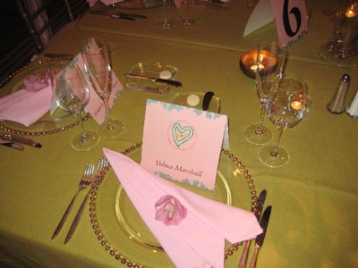 The evening's linens and settings all reflected the sorority's pink and green signature colors.