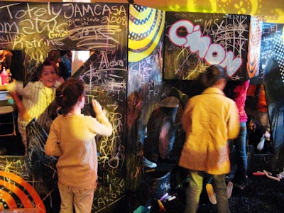 Children scrawled graffiti-like messages across chalkboard panels at Nickelodeon's Kids' Choice awards after-party in Los Angeles in April.
