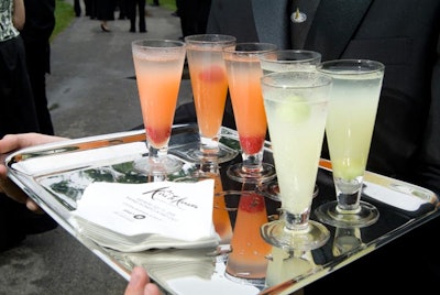 As guests arrived, waiters from Jewell Events catering served honeydew lemonade and a raspberry-mango vodka cocktail.